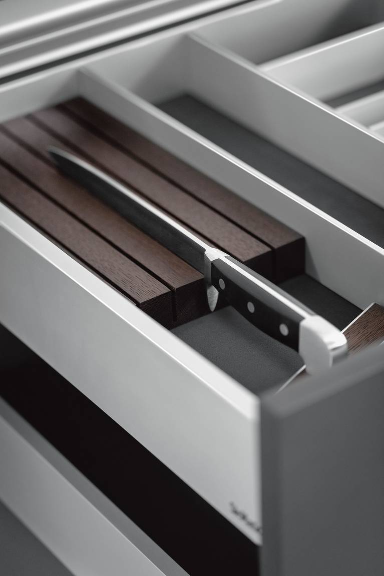 The knife block from the SieMatic Aluminum Interior Accessories System for the kitchen elegantly protects high-grade knives.